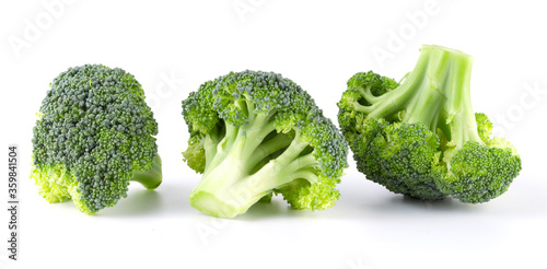 Fresh three green tasty broccoli in closeup isolated on white background