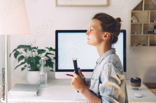 Woman freelancer indoors home office concept.