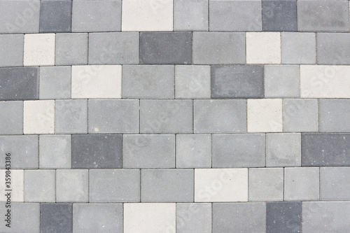 Neatly laid gray paving slabs. Abstract background.