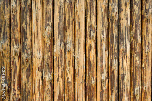 wooden pattern from vertical brown planks and old weathered dark brown background