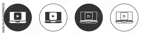 Black Online play video icon isolated on white background. Laptop and film strip with play sign. Circle button. Vector Illustration.