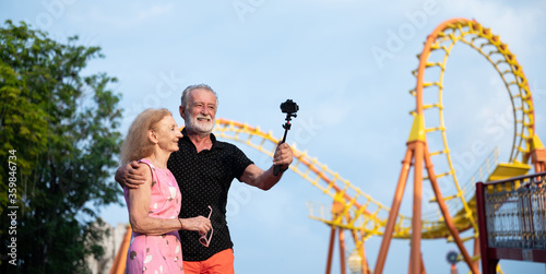 Senior couple taking a self...