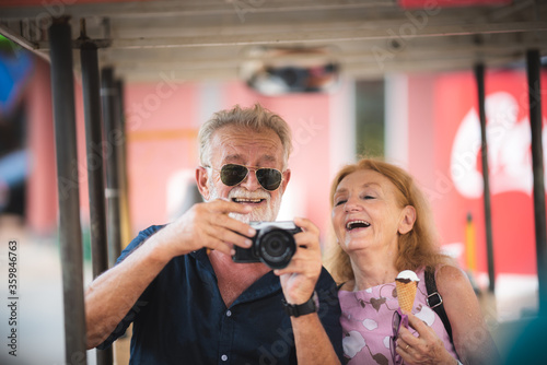 Senior couple taking a self...