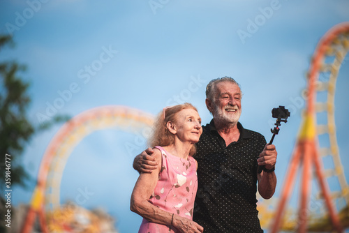 Senior couple taking a self...