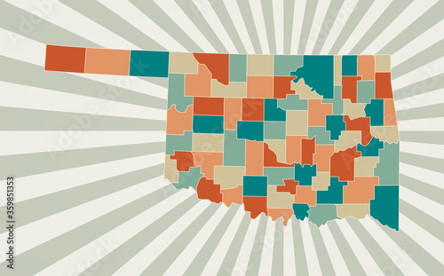 Oklahoma map. Poster with map of the US state in retro color palette. Shape of Oklahoma with sunburst rays background. Vector illustration.