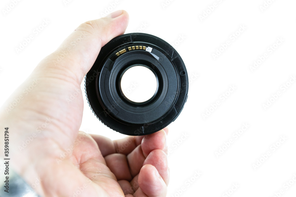 macro lens in male hands visible light through the lens on an isolated background macro lens in male hands visible light through the lens on an isolated background