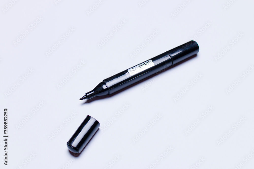 black marker on white background, closeup black marker on white background, closeup