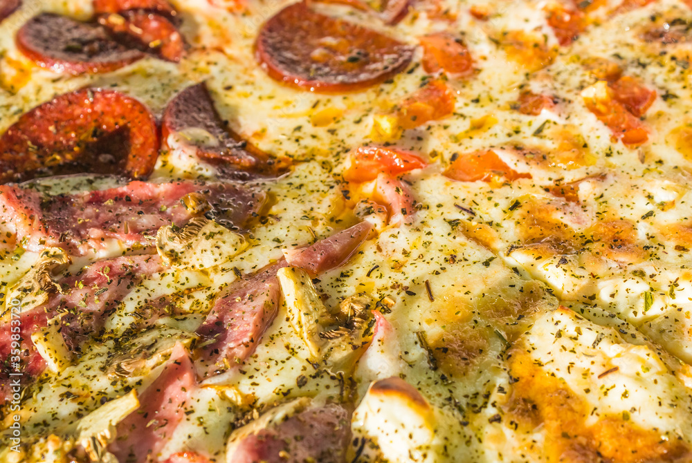 fresh cooked hot pizza close up with tomatoes, pepperoni and mushrooms in the delivery box. fast food summer concept fresh cooked hot pizza close up with tomatoes, pepperoni and mushrooms in the delivery box. fast food summer concept