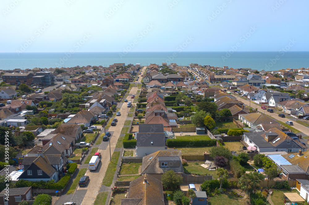 Aerial photo of  Peacehaven on the East Sussex coast looking towards the English Channel on a warm and sunny summers day.