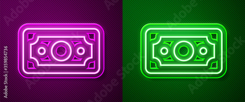 Glowing neon line Stacks paper money cash icon isolated on purple and green background. Money banknotes stacks. Bill currency. Vector Illustration.