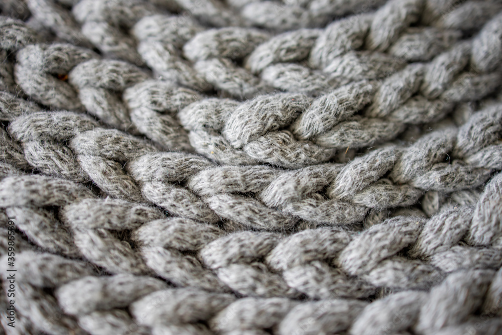 interesting background made of crochet hand-made, gray cotton cord
