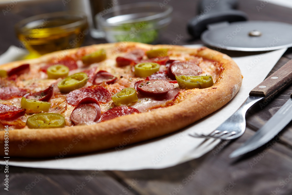 tasty pizza on the wooden background tasty pizza on the wooden background