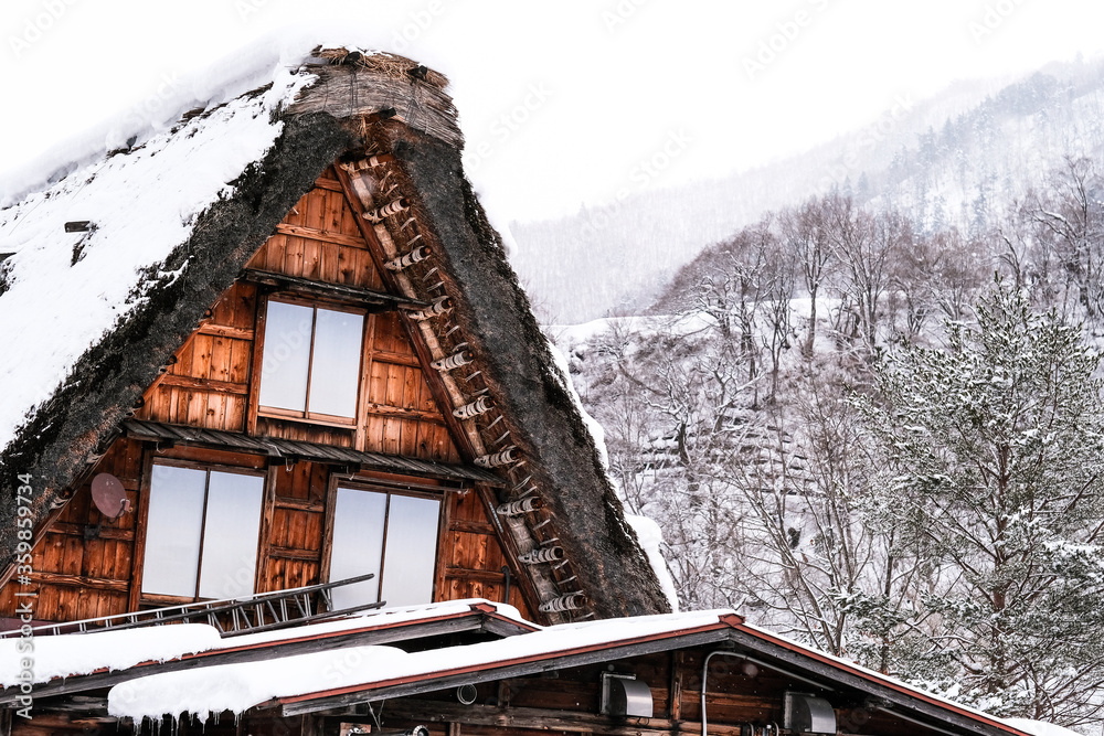 A house with thick snow covering the roof in Shirakawago Village, Shirakawago Japan. A house with thick snow covering the roof in Shirakawago Village, Shirakawago Japan.