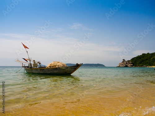 Beautiful view of a boat in the water in a sunny day  in Vietnam. Hoian is recognized as a World Heritage Site by UNESCO