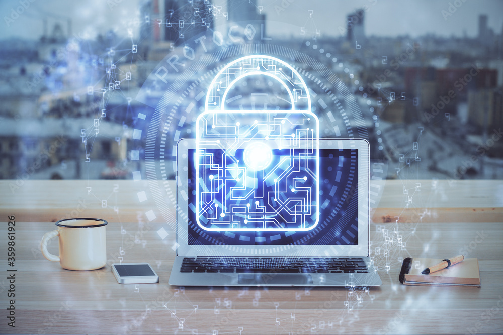 Double exposure of desktop with computer and lock icon hologram. Concept of data safety. Double exposure of desktop with computer and lock icon hologram. Concept of data safety.