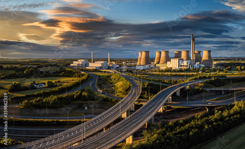 M62 and A1 Motorway in Yorkshire, England drone aerial photo showing junction 32A near Ferrybridge and Castleford showing the Ferrybridge C Power Station and cooling towers