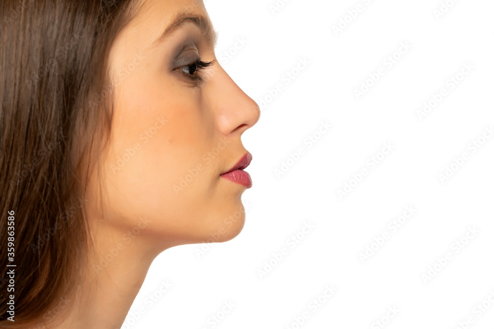 closeup profile of young beautiful woman closeup profile of young beautiful woman