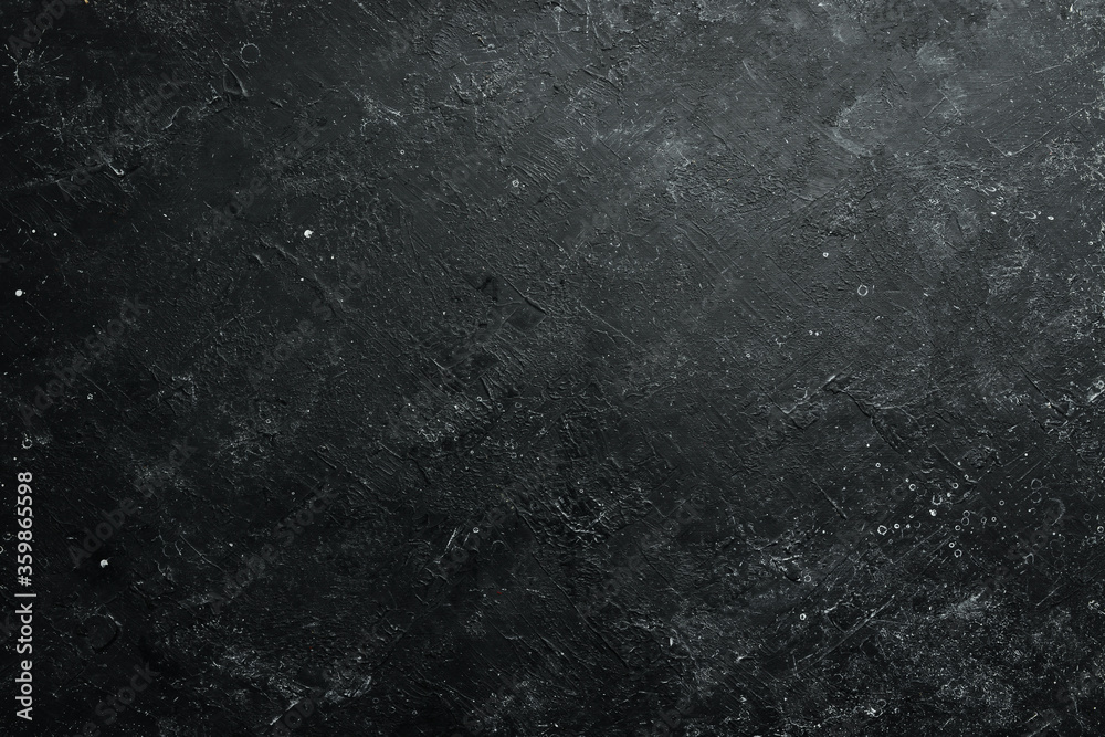 Black stone background. Free space for your text. Top view. Rustic style.