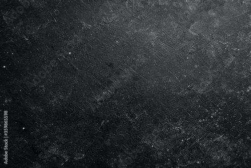 Black stone background. Free space for your text. Top view. Rustic style.