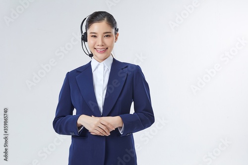 Call center Asian female, smiling business woman, customer Service Agent with headset isolated over white background
