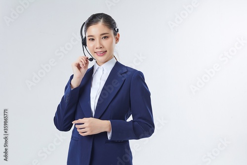 Call center Asian female, smiling business woman, customer Service Agent with headset isolated over white background