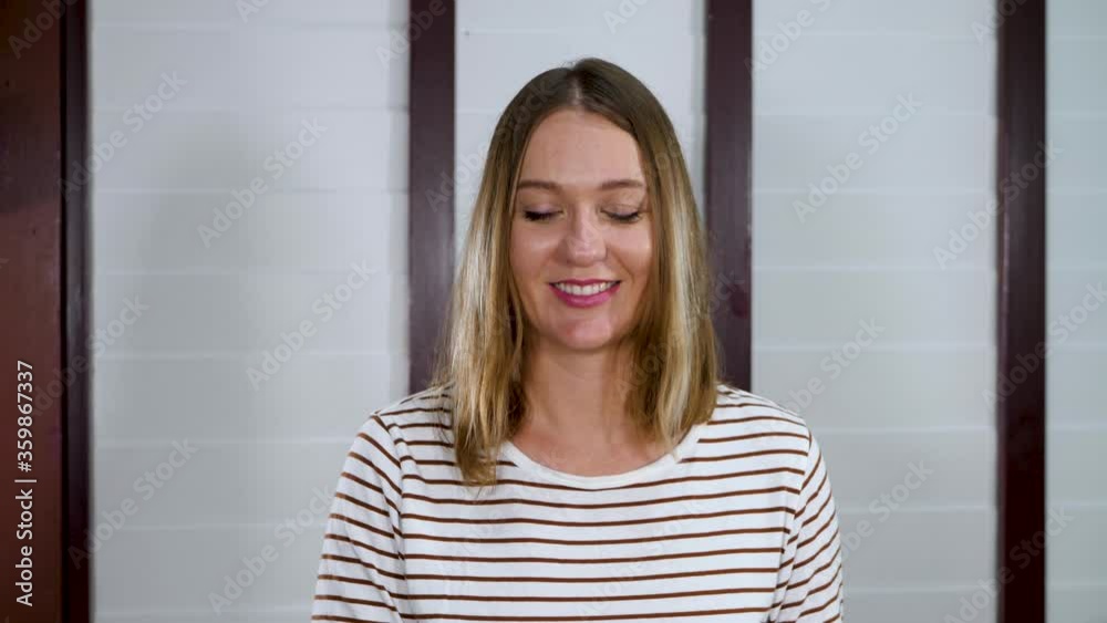 Smile female teacher has distance education lesson. Make video call to teach math and counting. Online class or e-learning at home. White wall background Smile female teacher has distance education lesson. Make video call to teach math and counting. Online class or e-learning at home. White wall background
