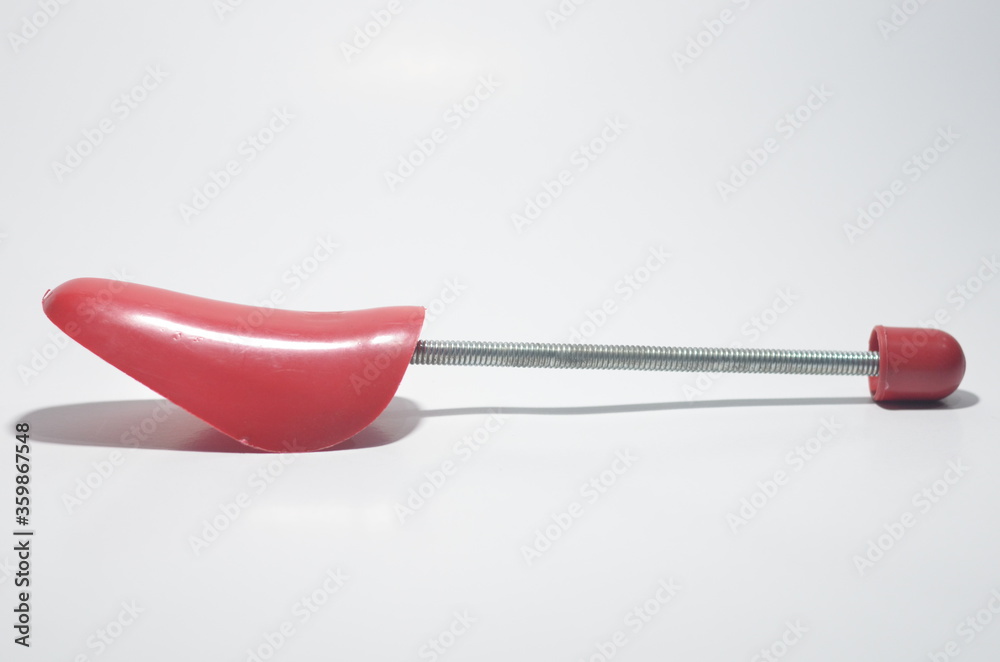 Red Plastic Shoe Tree on White Isolated Background Red Plastic Shoe Tree on White Isolated Background