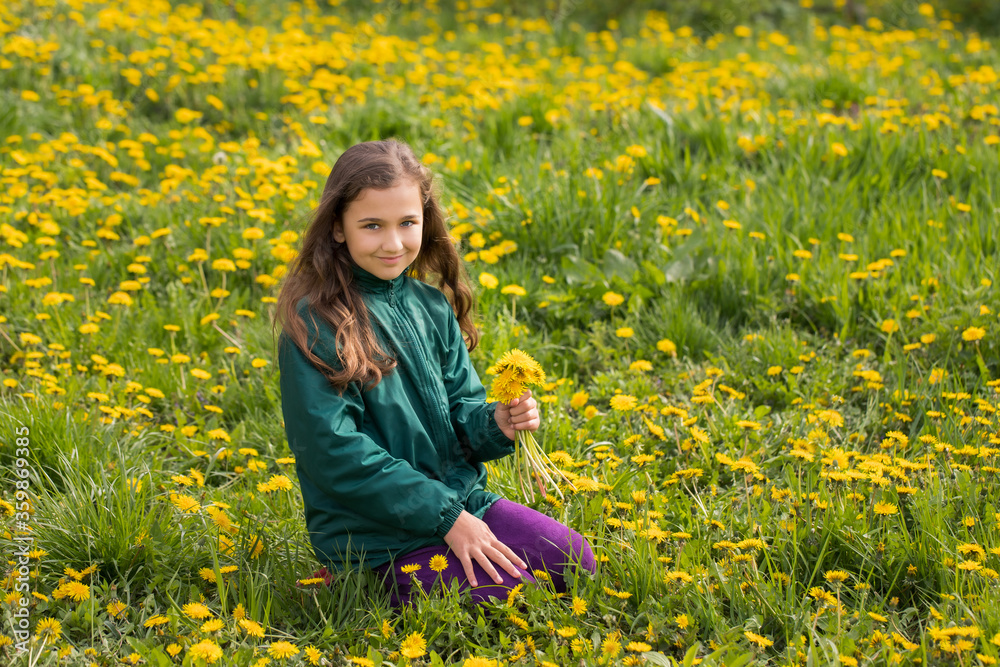 Little Girl With Bouquet Of Dandelions, In Grass With Blooming Dandelions In Spring. Little Girl With Bouquet Of Dandelions, In Grass With Blooming Dandelions In Spring.