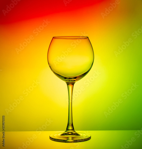 empty glass goblet close-up on a color gradient background