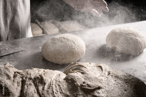 Baker working the bread dough.