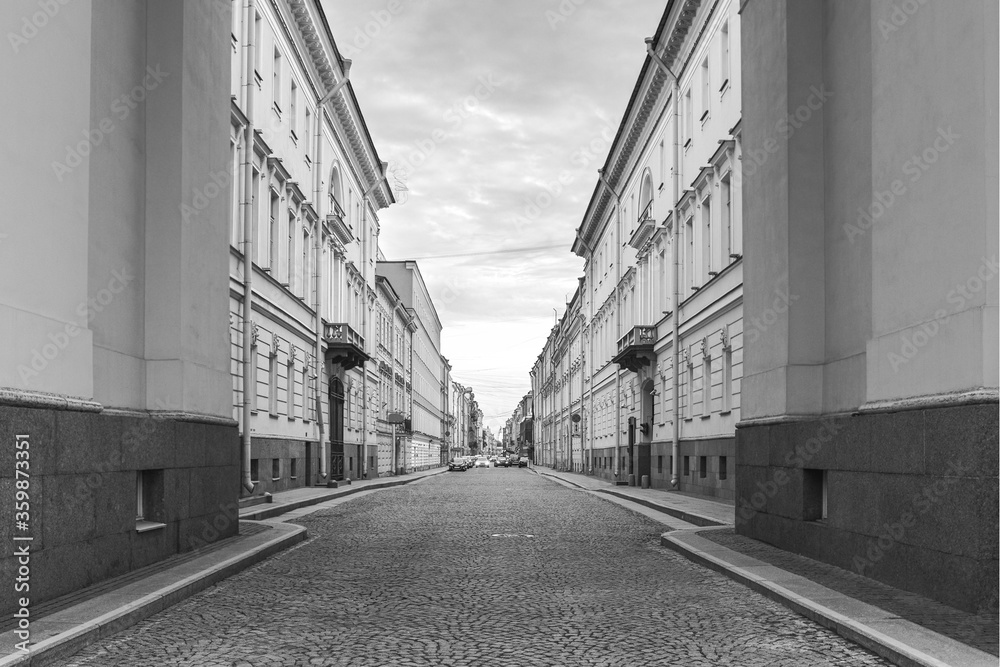 one of the many narrow stone-paved streets of the historical center of St. Petersburg