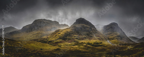 The Three Sisters Mountains, Glencoe in the Scottish highlands. Famous three peaks of Glencoe.  photo