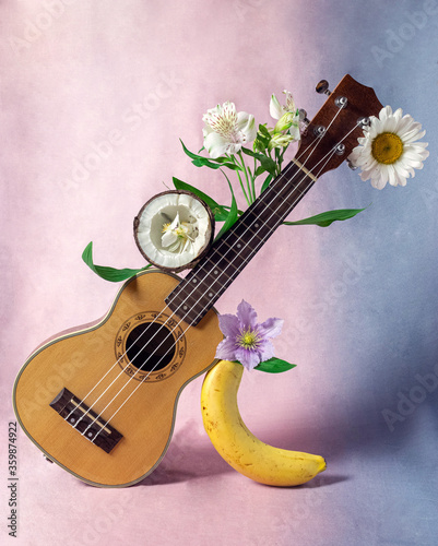 ukulele with flowers and fruits  photo