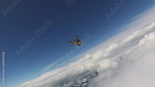 Skydiving. Tandem jump. Man and woman are in the sky.