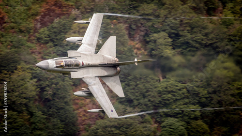 Schilderij op canvas RAF (Royal Air Force) Panavia Tornado GR4 Fighter Bomber and reconnaissance jet flying low level in the UK, Cumbria, Wales and Scotland