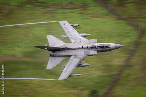 RAF (Royal Air Force) Panavia Tornado GR4 Fighter jet flying low level in the UK, Cumbria, Wales and Scotland.   photo