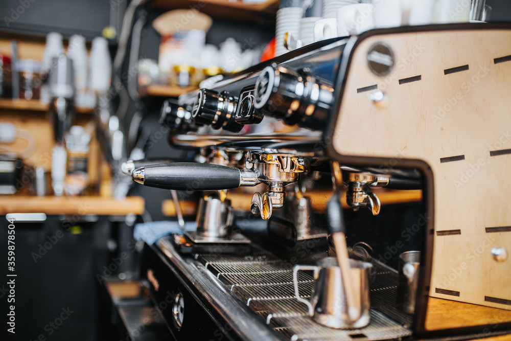 Professional commercial coffee machine in a cafe professional barista makes espresso Stock Adobe Stock