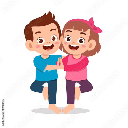 happy cute little kid boy and girl do yoga pose