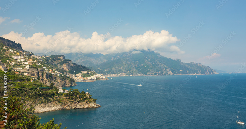 Panoramic view of beautiful Amalfi on hills leading down to coast, Campania, Italy. Amalfi coast is most popular travel and holiday destination.
