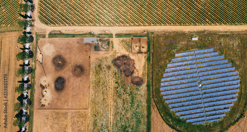 Aerial top view of station with solar batteries in agricultural area ...