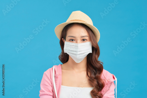 Woman wearing trendy spring, summer fashion outfit during quarantine of coronavirus outbreak.