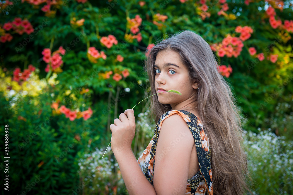 Portrait of a beautiful smiling girl. Happy girl in summer. Summer girl closeup. Smiling girl with long hair
