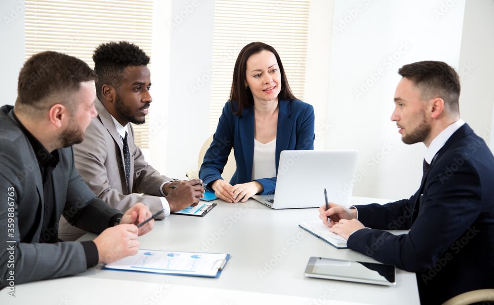 Multy-ethnic group of business people working at office Multy-ethnic group of business people working at office