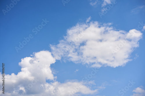 Blue sky with white fluffy cloud summer sunny day