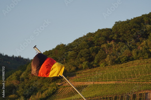 German flag on a boat while sunset 