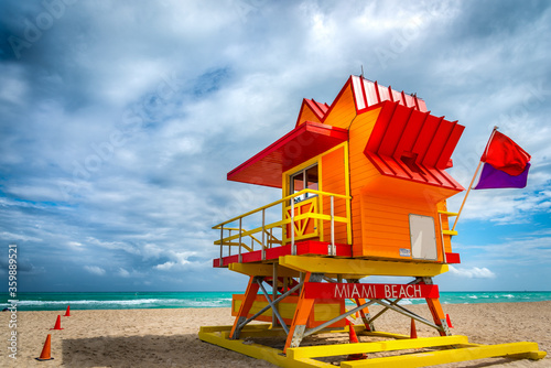 Cloudy sky over  a colorful lifeguard tower in South Beach © Gabriele Maltinti