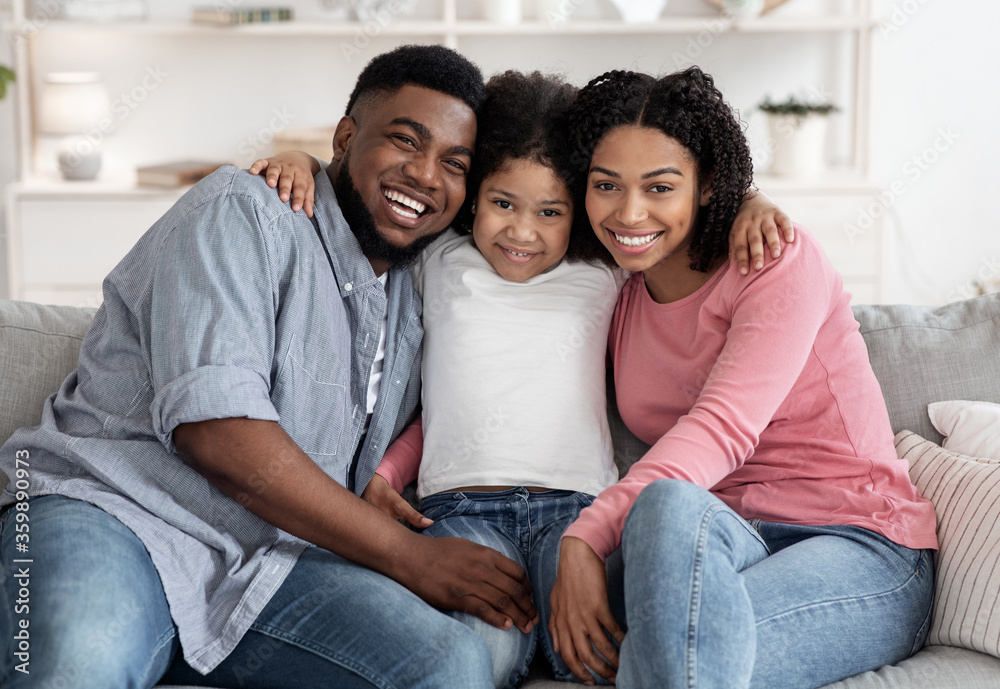 Happy African American Family Posing For Portrait At Home, Embracing And Smiling Happy African American Family Posing For Portrait At Home, Embracing And Smiling