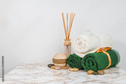 Spa objects and elements on a marble table and white background