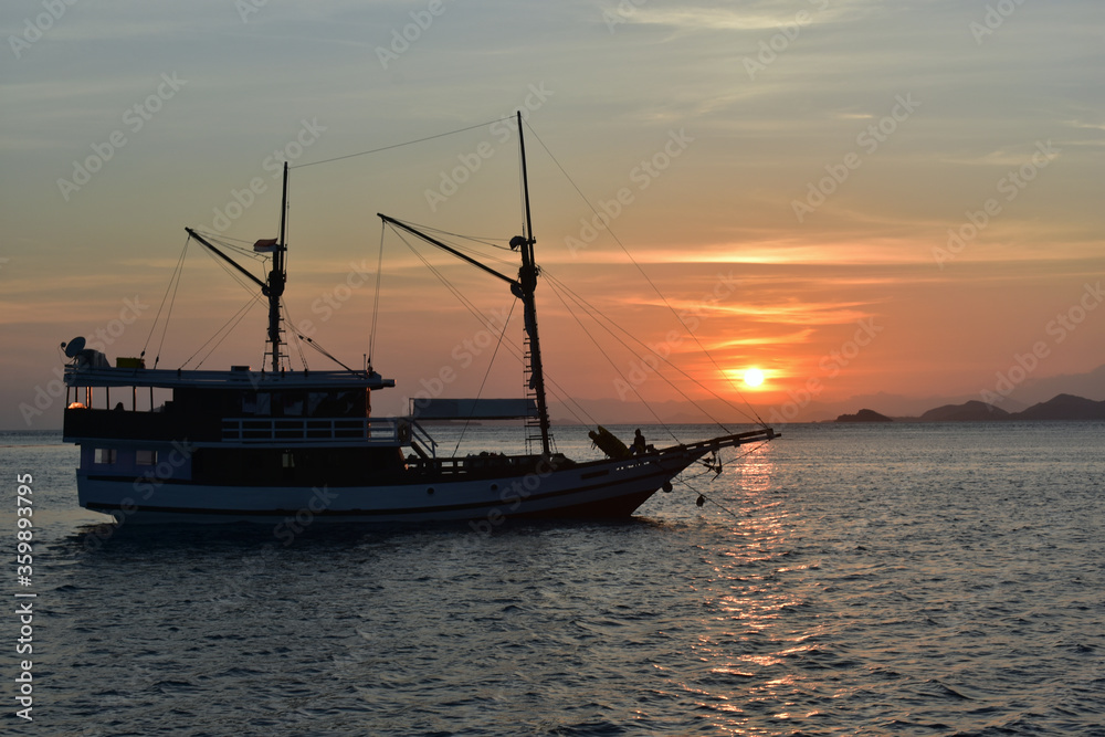 Fototapeta premium Fishing boat at sunset, Komodo Island, Labuan Bajo, East Nusa Tenggara, Indonesia