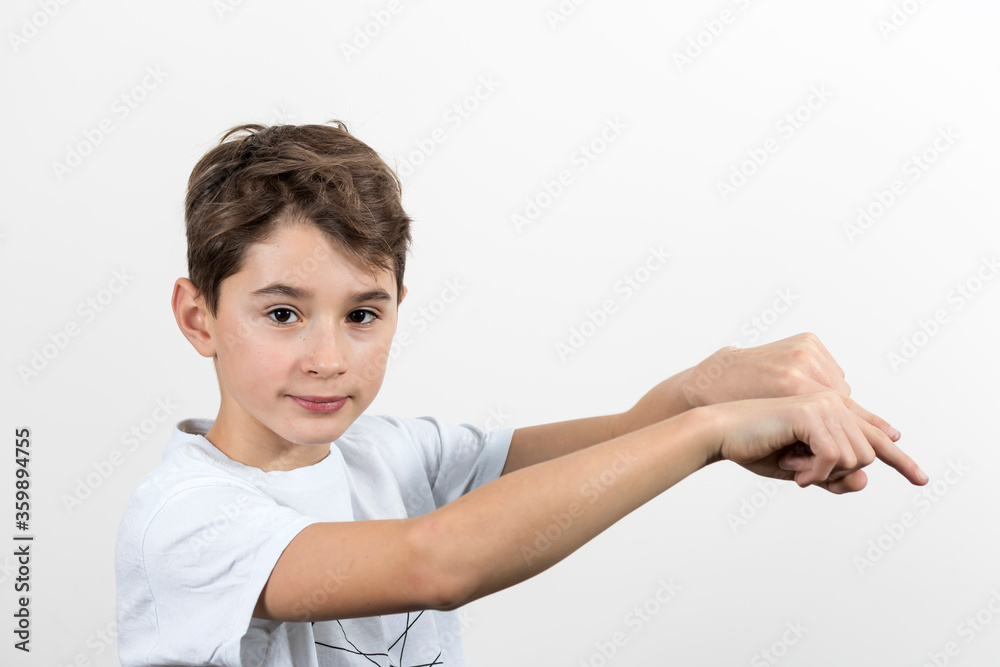 Teenage boy in white shirt. Portrait in studio. Funny faces. Teenage boy in white shirt. Portrait in studio. Funny faces.